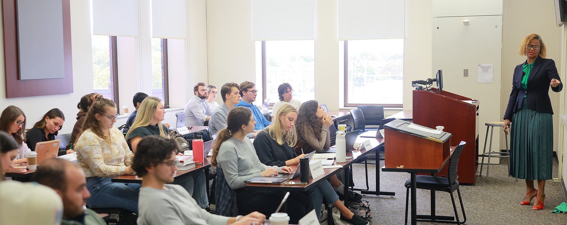Law students sit in a classroom as a professor teaches.