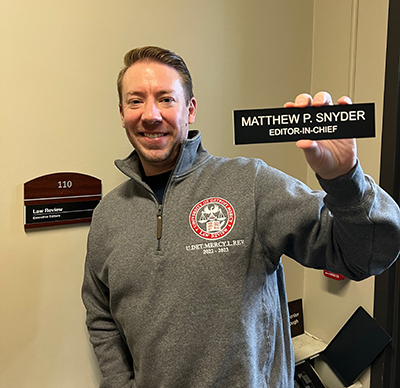 Matt Snyder with name plate for Law Review